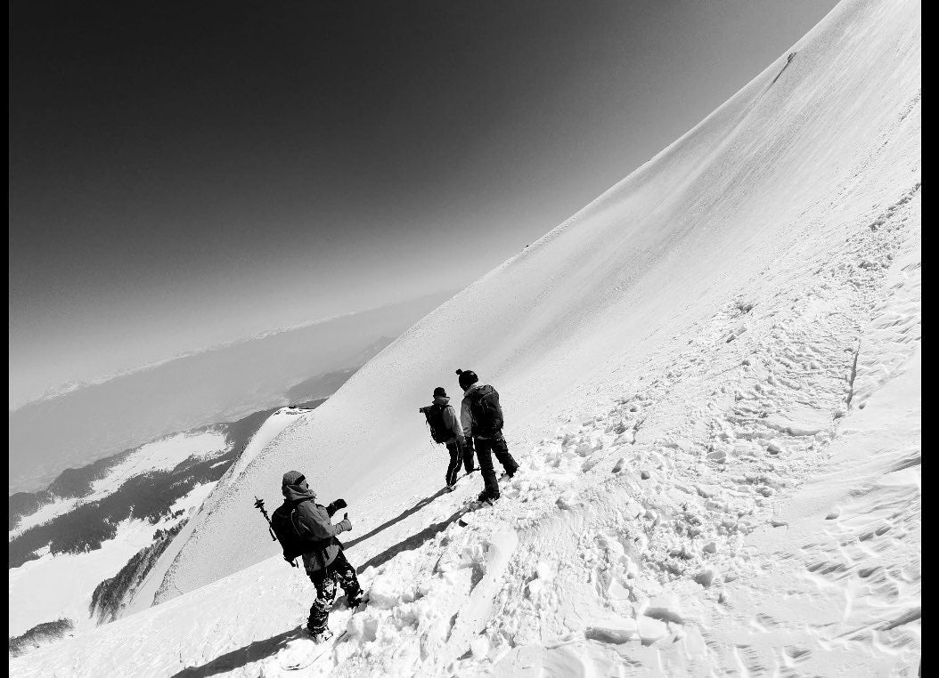 A group of snowboarders at one of the North Bowls in Gulmarg